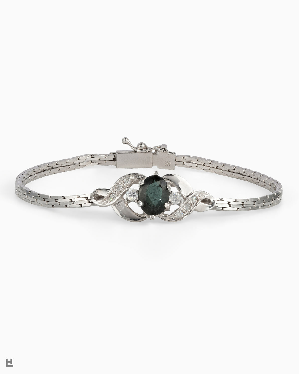 Bracelet vintage en argent avec pierre ovale verte entre deux volutes