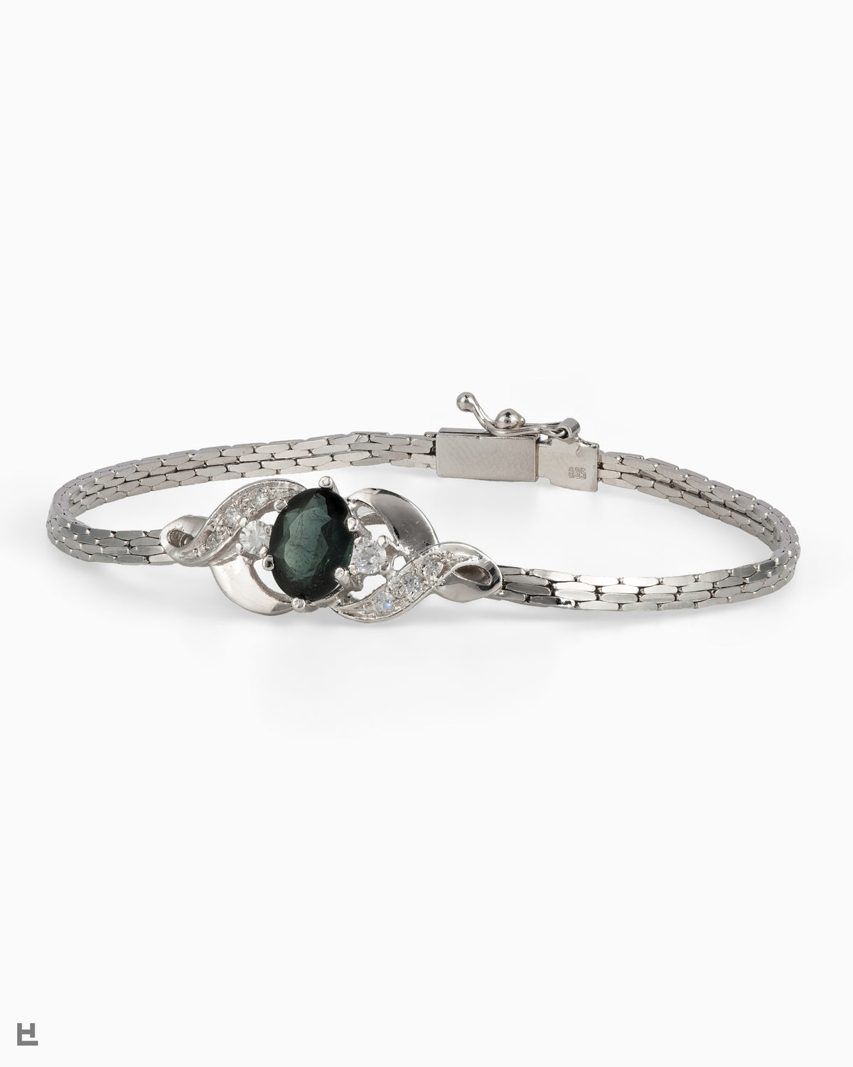 Bracelet vintage en argent avec pierre ovale verte entre deux volutes