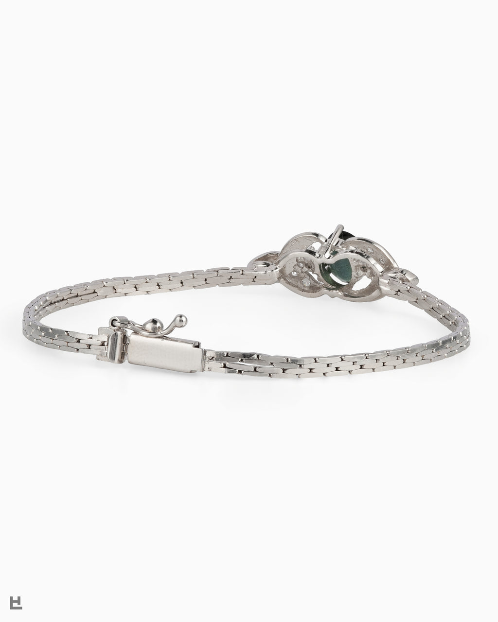Bracelet vintage en argent avec pierre ovale verte entre deux volutes