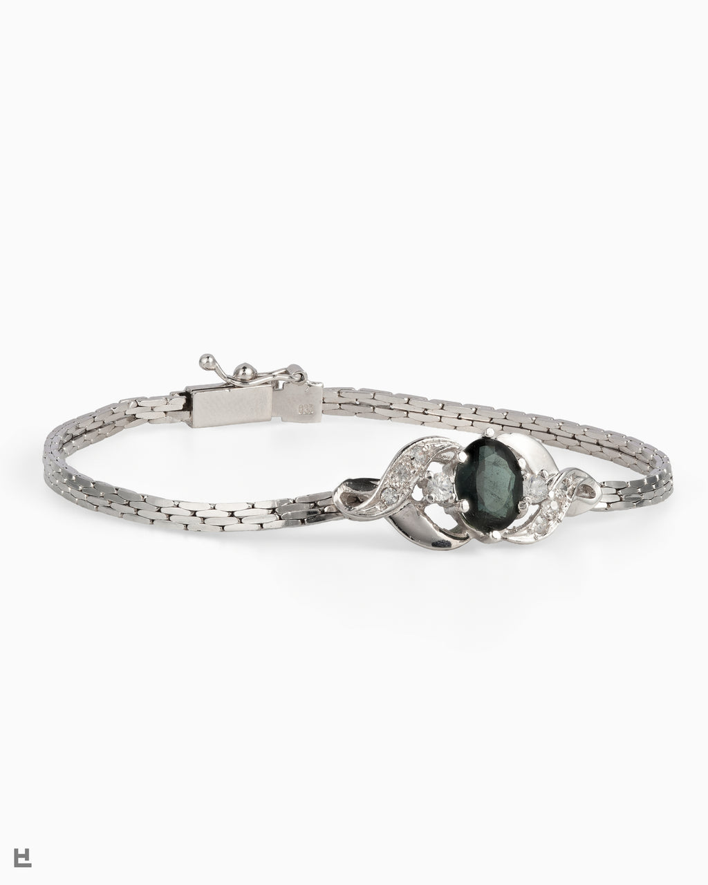 Bracelet vintage en argent avec pierre ovale verte entre deux volutes