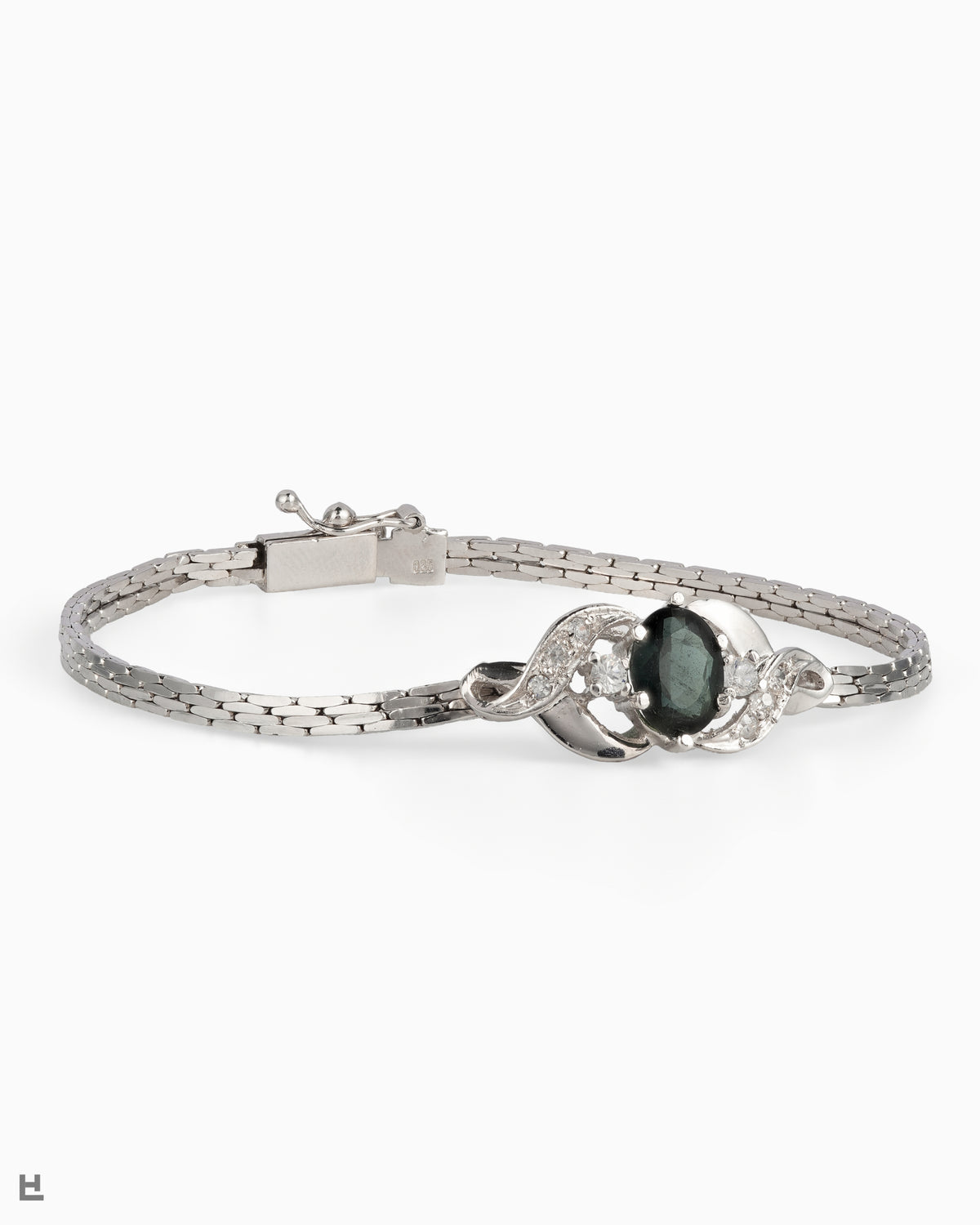 Bracelet vintage en argent avec pierre ovale verte entre deux volutes